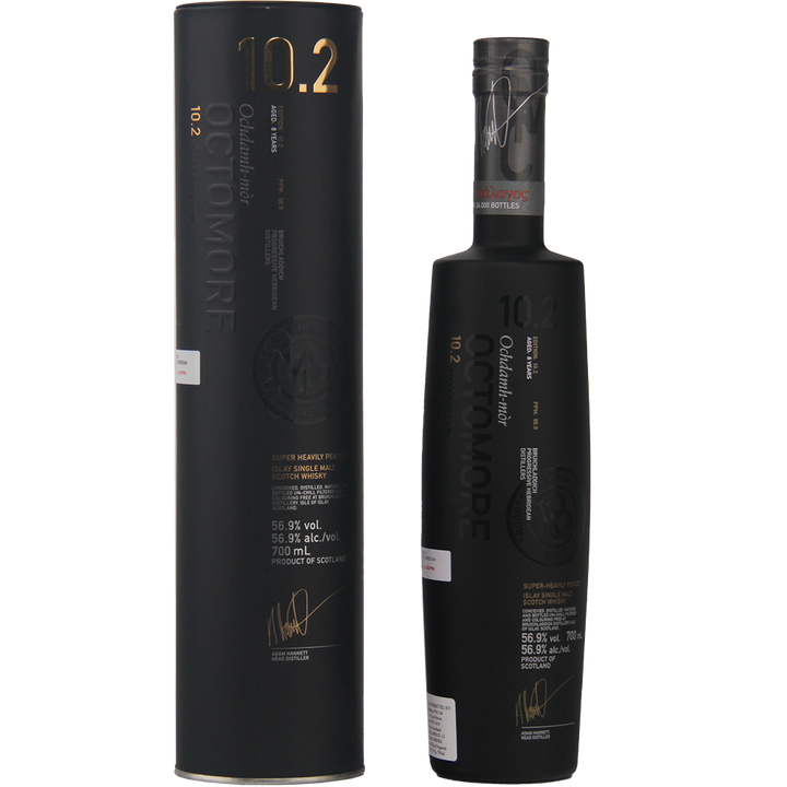 A matte black bottle of Bruichladdich Octomore 10.2 Cask Strength Single Malt Scotch Whisky stands beside its matching cylindrical box, both adorned with gold and white text highlighting the brand and whisky details.