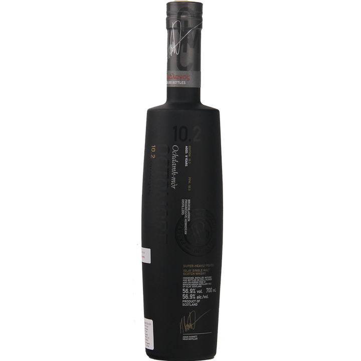 A tall, matte black bottle of Bruichladdich Octomore 10.2 Cask Strength Single Malt Scotch Whisky with white and gold text displaying alcohol content, volume, and branding.