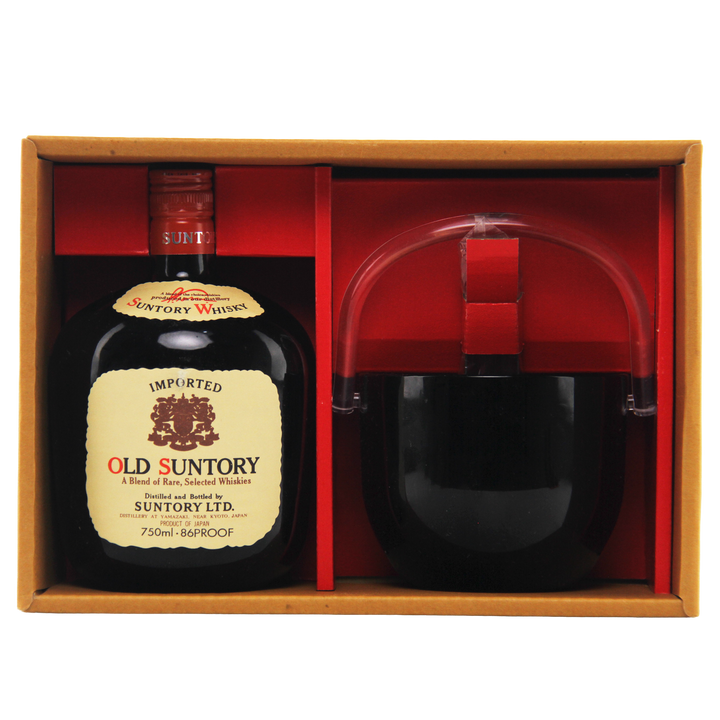 Old Suntory whiskey bottle with a glass in a wooden box