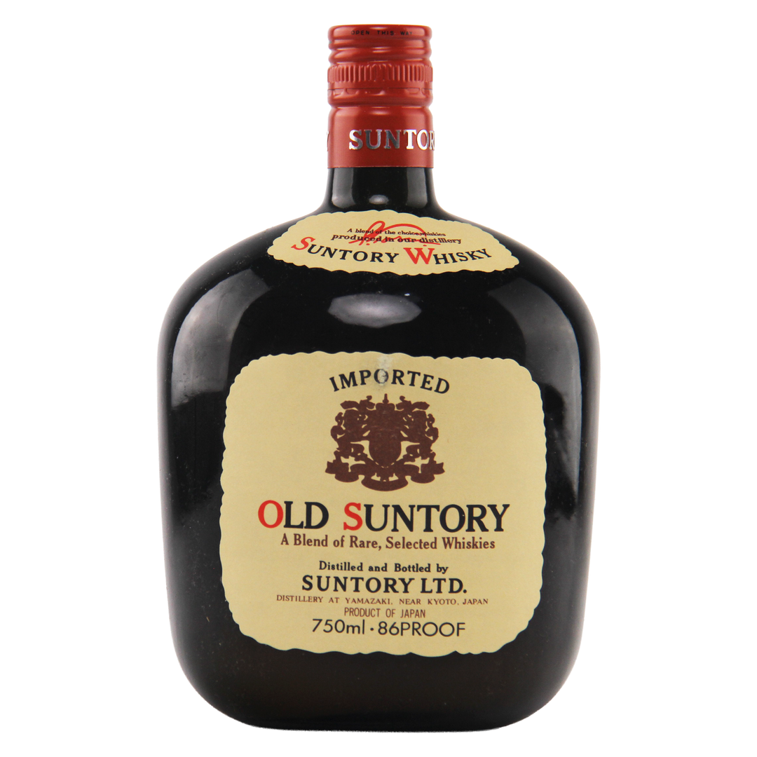 Old Suntory whisky bottle with a red cap on a white background