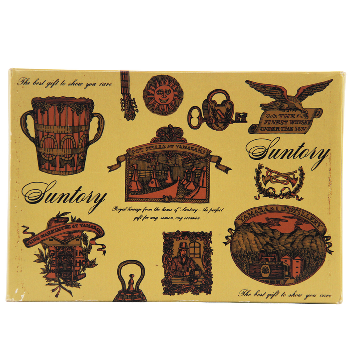 Vintage-style Suntory product packaging with decorative graphics and text.