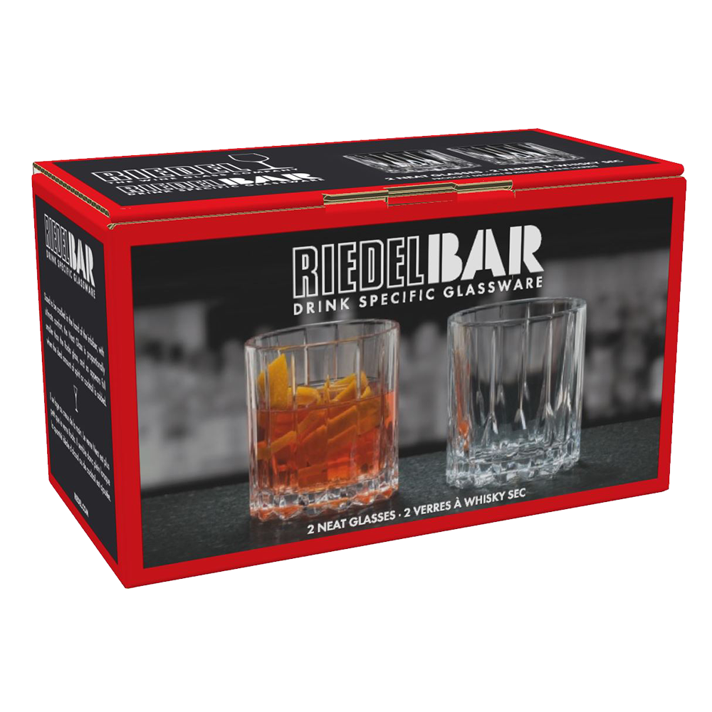 A red and black RIEDEL Neat Whisky Glass Set of 2 box displays two glasses—one with an amber drink and ice, one empty. The set includes two whisky glasses, ideal for spirit-focused cocktails.