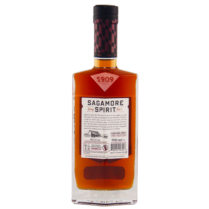 A rectangular bottle of Sagamore Small Batch Straight Rye American Whiskey with amber liquid, a black and red cap, and a front label featuring the brand name, product details, and a horse-drawn plow illustration—a true Maryland rye.