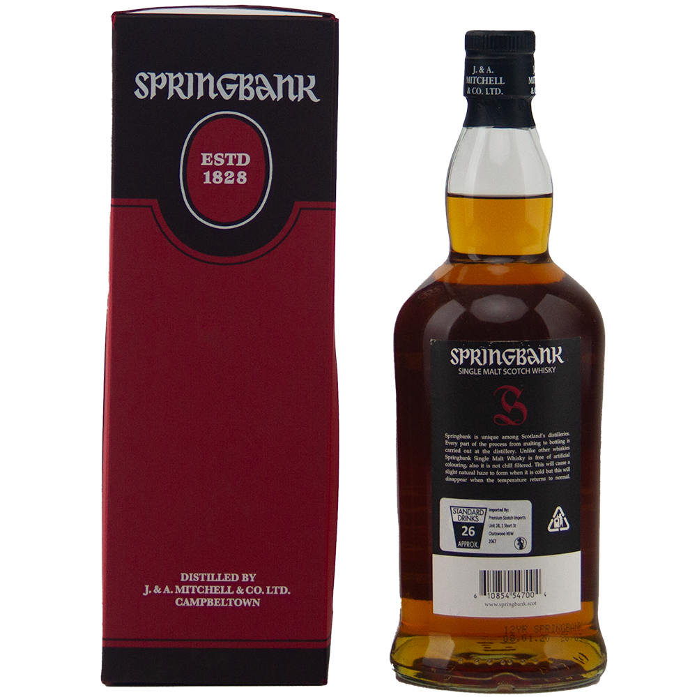 A bottle of Springbank 12 Year Old Cask Strength 55.3% sits beside its red and black box, displaying the brand name, "Established 1828," and distillery info. The bottle’s back label is also visible.