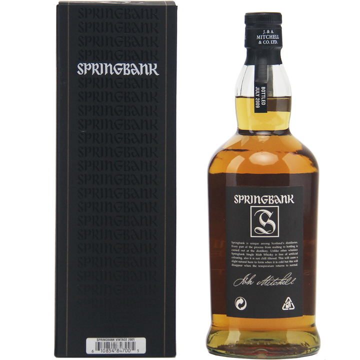 A bottle of Springbank Vintage 2001 Single Malt Scotch Whisky with a black cap stands next to its black box packaging, both displaying the Springbank logo and white branding. The bottle holds cask strength, amber-colored whisky.