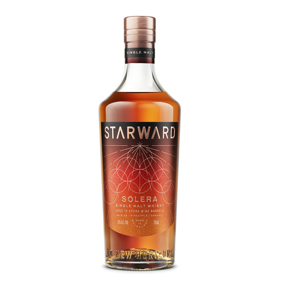 A bottle of Starward Solera Australian Single Malt Whisky with a copper cap and a dark red and gold geometric label highlighting its unique maturation in Apera barrels.