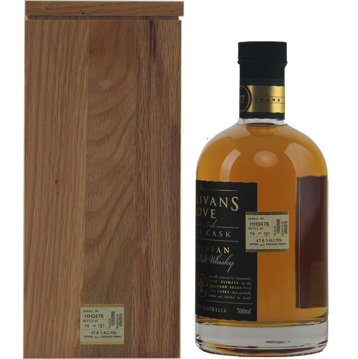 A bottle of Sullivans Cove 17 Year Old Cask HH0476, matured in American oak ex-bourbon cask, stands beside its wooden box. The black-capped bottle has a tan label and displays rich amber whisky inside.