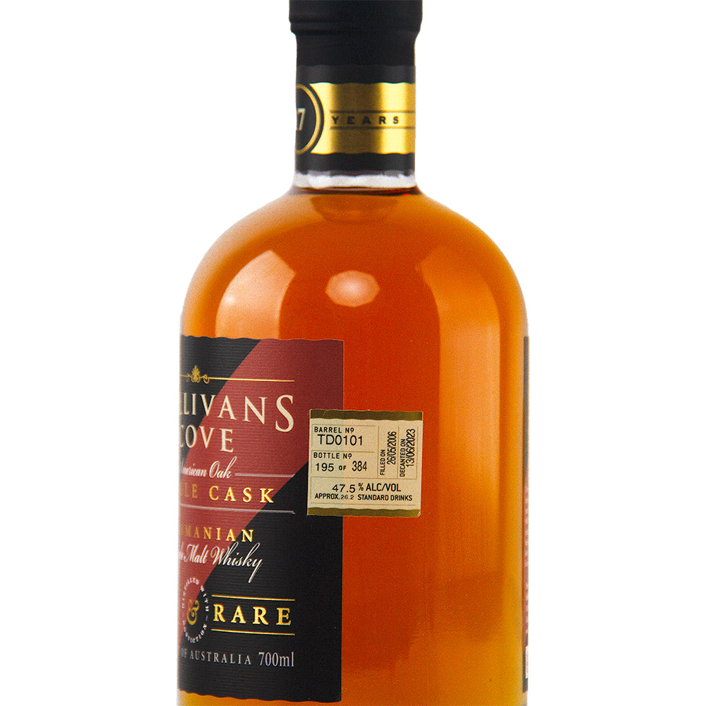 A close-up of a Sullivan's Cove 17yo Old & Rare TD0101 2nd Fill American Oak bottle, highlighting its amber liquid, black and gold label, and details on the barrel, bottle number, and alcohol content.