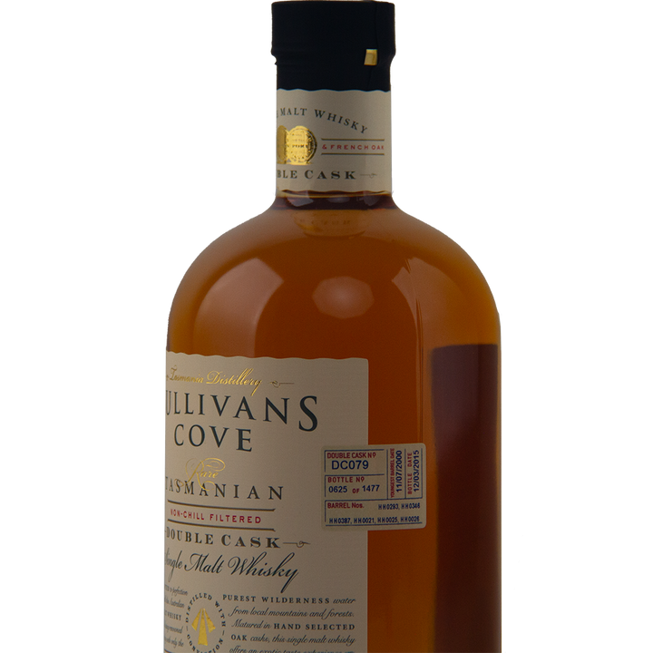 A close-up of a brown bottle of Sullivans Cove Double Cask DC079 Single Malt Whisky, showing the label and neck tag, with details about its maturation in French and American oak casks and specific batch information.
