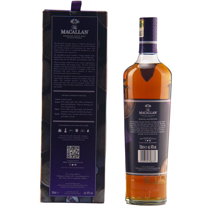 A bottle of The Macallan Concept Number 2 Single Malt Scotch Whisky stands beside its box, featuring a purple label and amber liquid, with the box displaying detailed product info in white text.