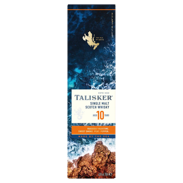 Tall rectangular box of Talisker 10 Year Old Single Malt Scotch Whisky, with ocean waves at the top, rocky shore below, and blue, white, and orange labels. "Made by the sea" highlights this renowned single malt's maritime character.