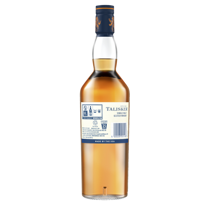 A bottle of Talisker 10 Year Old Single Malt Scotch Whisky viewed from the back, displaying the label with product details and recycling symbols. The amber liquid is visible inside, and the bottle features a blue cap with gold accents.
