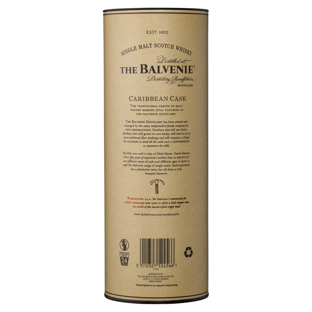 A cylindrical container of The Balvenie Caribbean Cask 14 Year Old Single Malt Scotch Whisky, with brand details, tasting notes, and a barcode on the beige label of this rum cask-finished whisky.