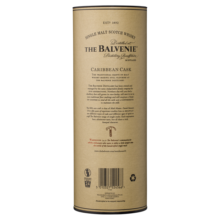 A cylindrical container of The Balvenie Caribbean Cask 14 Year Old Single Malt Scotch Whisky, with brand details, tasting notes, and a barcode on the beige label of this rum cask-finished whisky.
