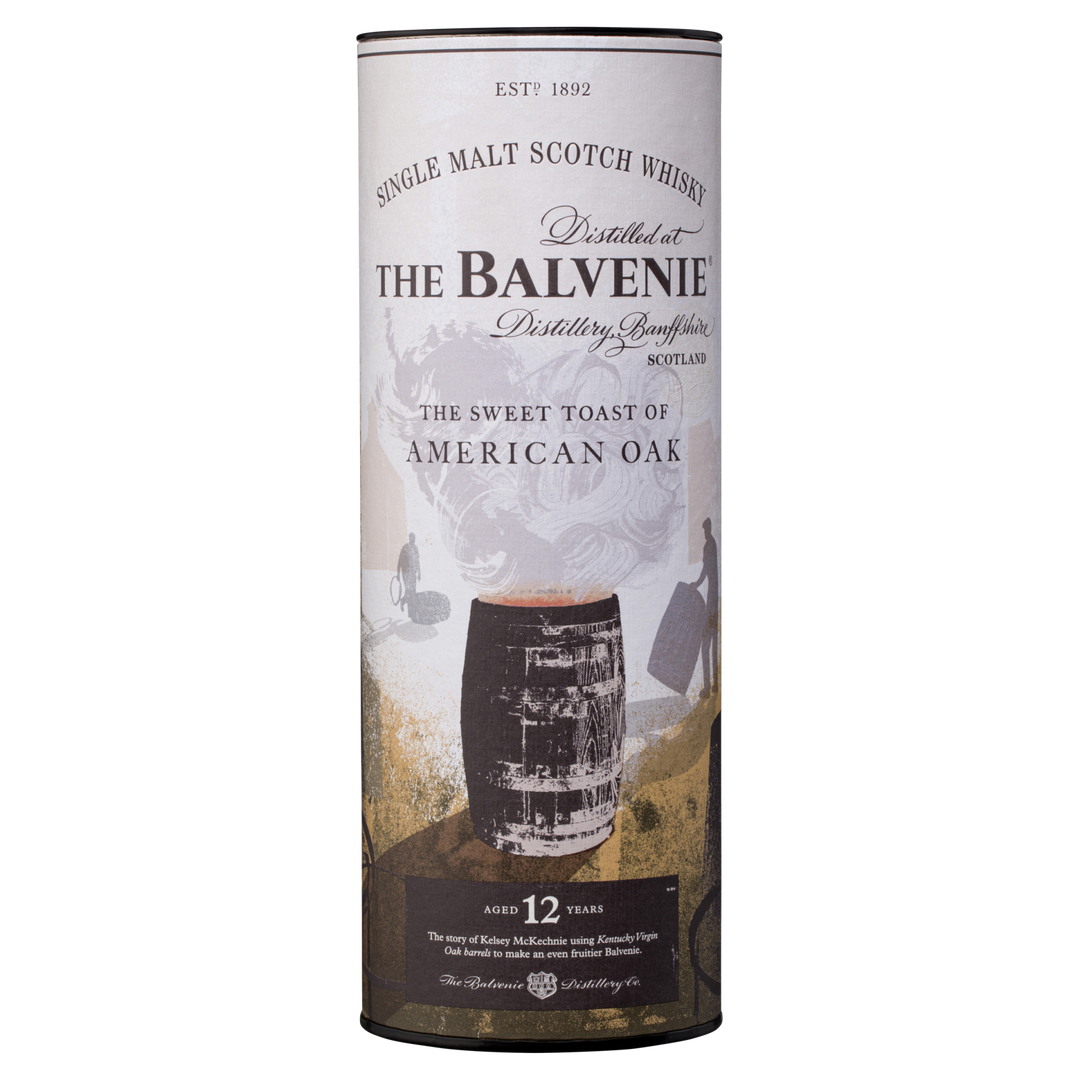 A cylindrical container of The Balvenie Stories The Week of Peat 14 Year Old single malt Scotch whisky, featuring a barrel illustration and detailing on a white and brown background.