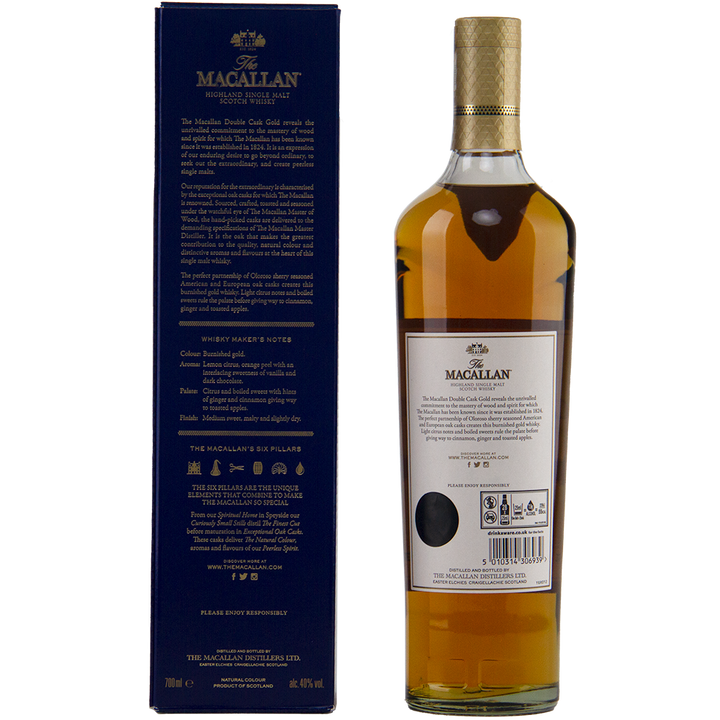 A bottle of The Macallan Double Cask Gold Single Malt Scotch Whisky stands beside its dark blue box, featuring gold and white text and a gold-capped top. The back label highlights the whisky’s sherry cask maturation.