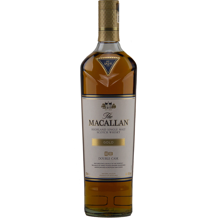 A bottle of The Macallan Double Cask Gold Single Malt Scotch Whisky, featuring a gold cap and label with black and gold text on clear glass, displays rich amber liquid matured in sherry casks.
