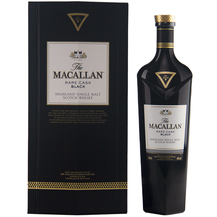 A black bottle of The Macallan Rare Cask Black Single Malt Scotch Whisky stands beside its matching black and gold box, both adorned with elegant white and gold labels that emphasize this smoky single malt whisky’s refined character.