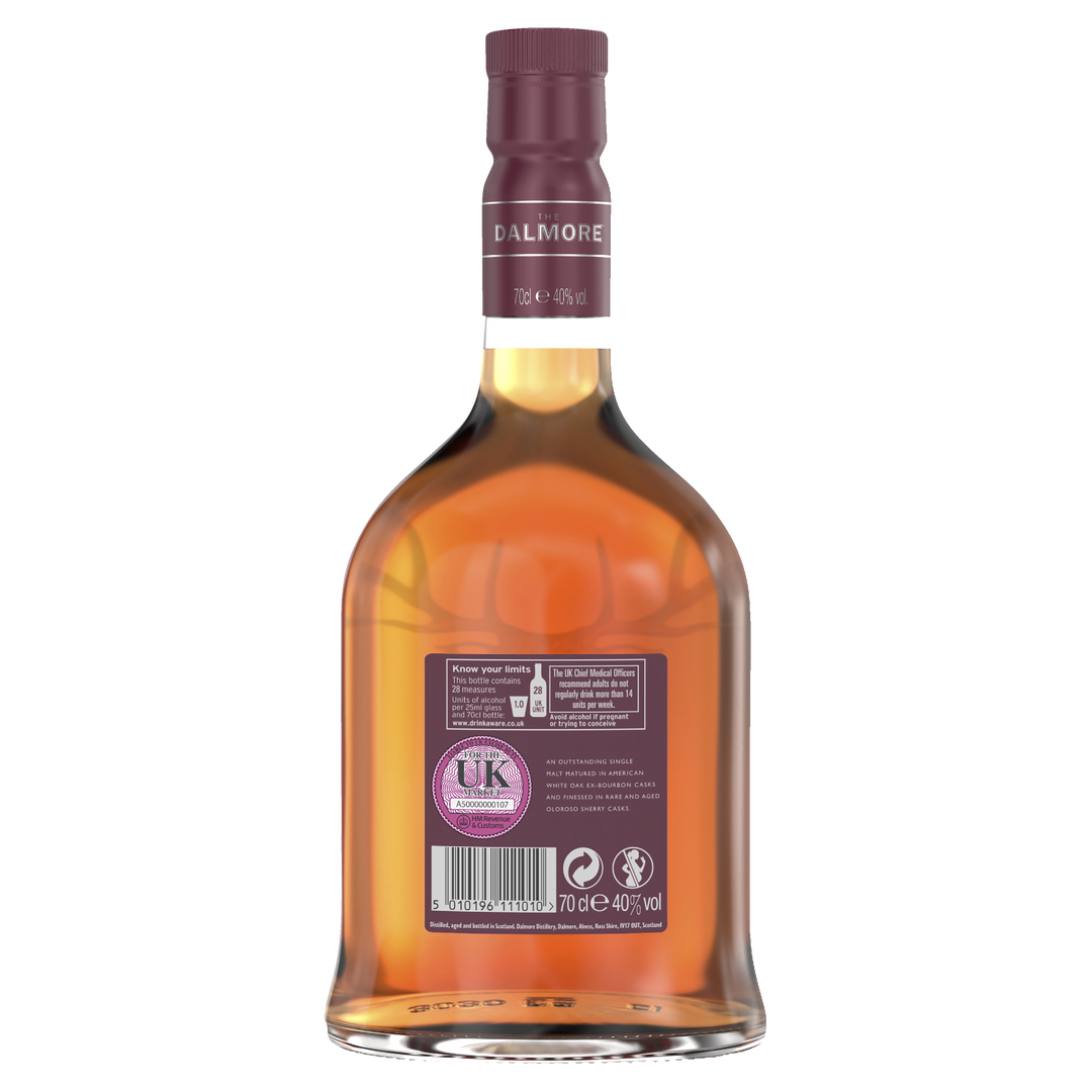 A bottle of The Dalmore 12 Year Old Single Malt Scotch Whisky viewed from the back, featuring a maroon cap, rear label with details, barcode, UK duty stamp, recycling symbols, and amber sherry cask whisky inside.