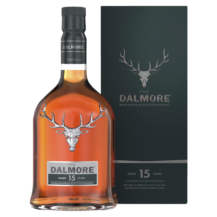 A bottle of The Dalmore 15 Year Old 2007 Vintage Single Malt Scotch Whisky with a dark green box, both featuring the silver stag logo and text noting the whisky’s 15 years of aging.