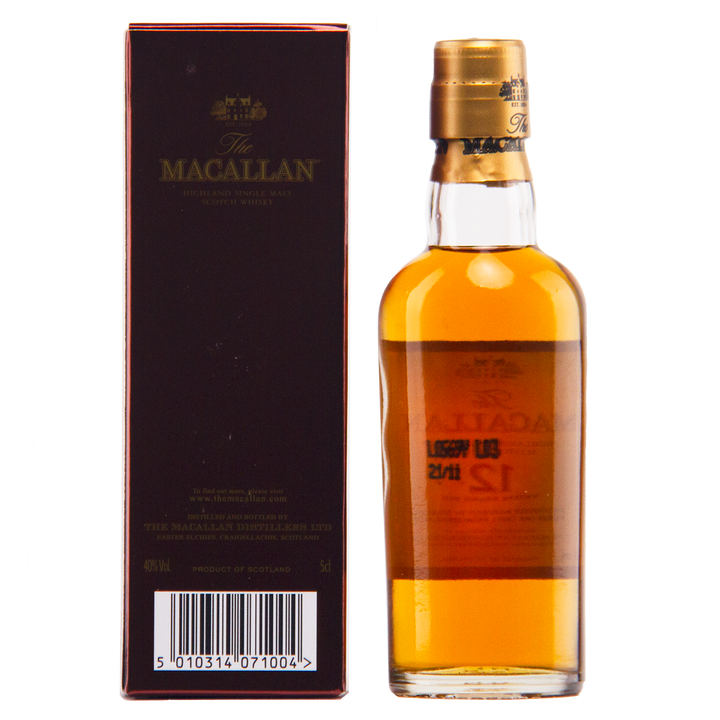 A bottle of The Macallan 12 Year Old Sherry Oak Cask (12x50ml) sits beside its box, showcasing the whisky’s rich amber color and the classic design of the packaging.