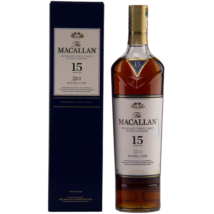 A bottle of The Macallan 15 Year Old Double Cask Single Malt Whisky stands next to its dark blue box, both displaying gold and white labels with the brand name and product details.