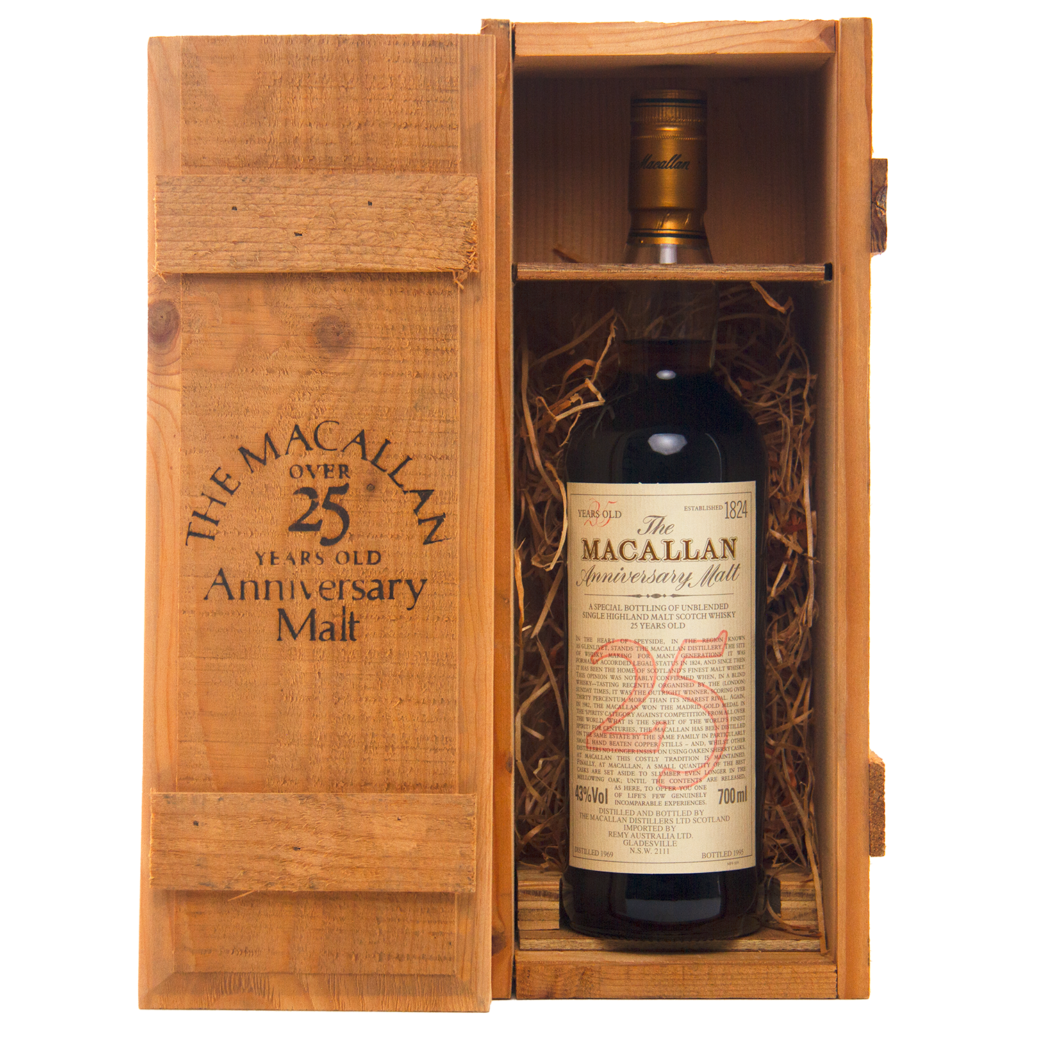 A bottle of The Macallan 1969 25 Year Old Anniversary Edition rests in a wooden presentation box with straw lining. The open lid reveals the whisky and branded text, emphasizing its prized sherry cask heritage.