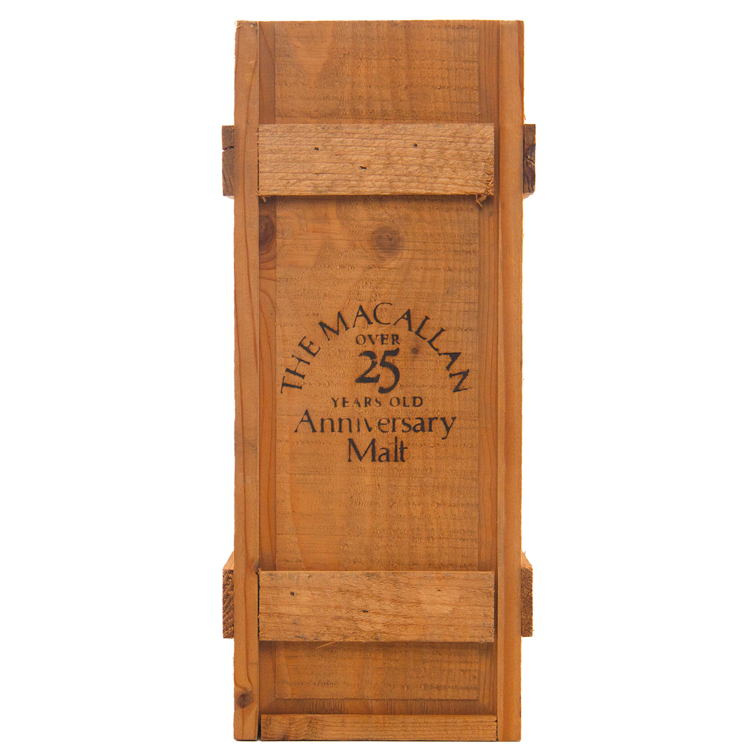 A rustic wooden box, reinforced with slats and bearing black text on the front, once housed The Macallan 1969 25 Year Old Anniversary Edition—a rare sherry cask-matured whisky celebrated for its exceptional depth and character.