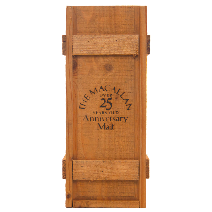 A rustic wooden box, reinforced with slats and bearing black text on the front, once housed The Macallan 1969 25 Year Old Anniversary Edition—a rare sherry cask-matured whisky celebrated for its exceptional depth and character.