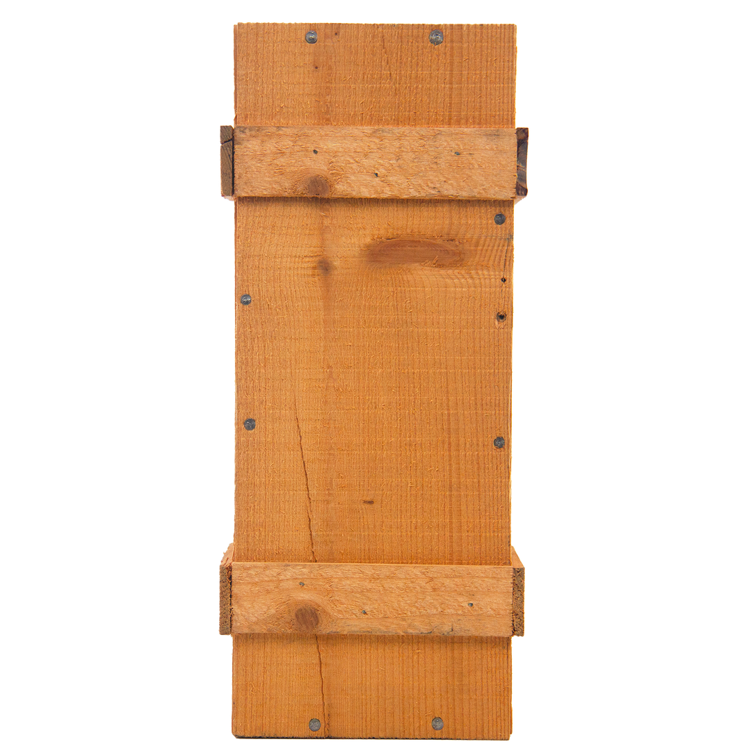 A rectangular wooden bat house with a simple design and visible screws, its natural finish echoes the rich tones of The Macallan 1969 25 Year Old Anniversary Edition, evoking the elegance of rare whisky craftsmanship.