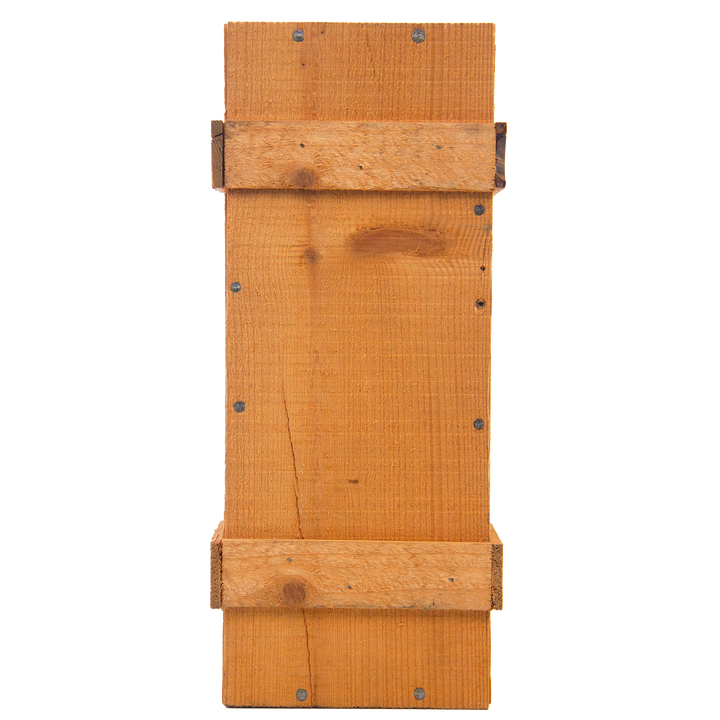 A rectangular wooden bat house with a simple design and visible screws, its natural finish echoes the rich tones of The Macallan 1969 25 Year Old Anniversary Edition, evoking the elegance of rare whisky craftsmanship.