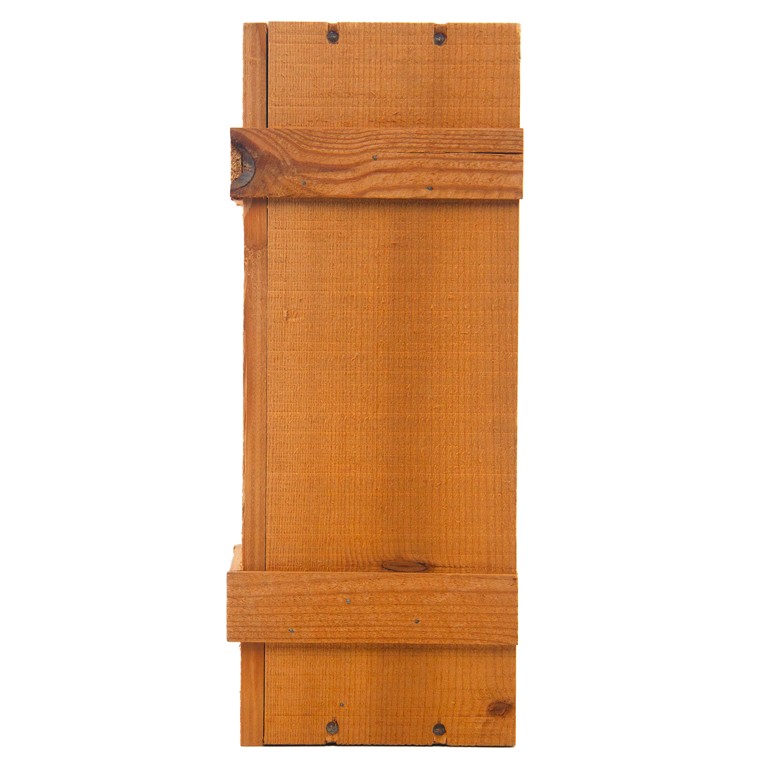 A rectangular wooden plank, featuring natural wood grain like a sherry cask and visible screws, evokes the craftsmanship of The Macallan 1969 25 Year Old Anniversary Edition.