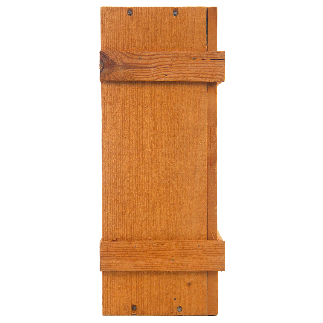 The Macallan 1969 25 Year Old Anniversary Edition: A finely crafted rectangular bat house with two horizontal support slats and visible screws, designed for mounting on a wall or tree.