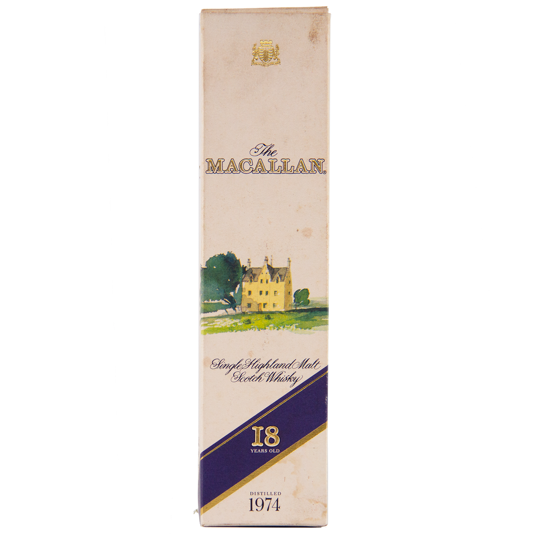 A cream-colored box of The Macallan 1974 18 Year Old Sherry Single Malt Scotch Whisky, with a gold crest, house and tree illustration, labeled "18 Years Old" and "Distilled 1974"—a highly collectible sherry oak-matured Scotch.