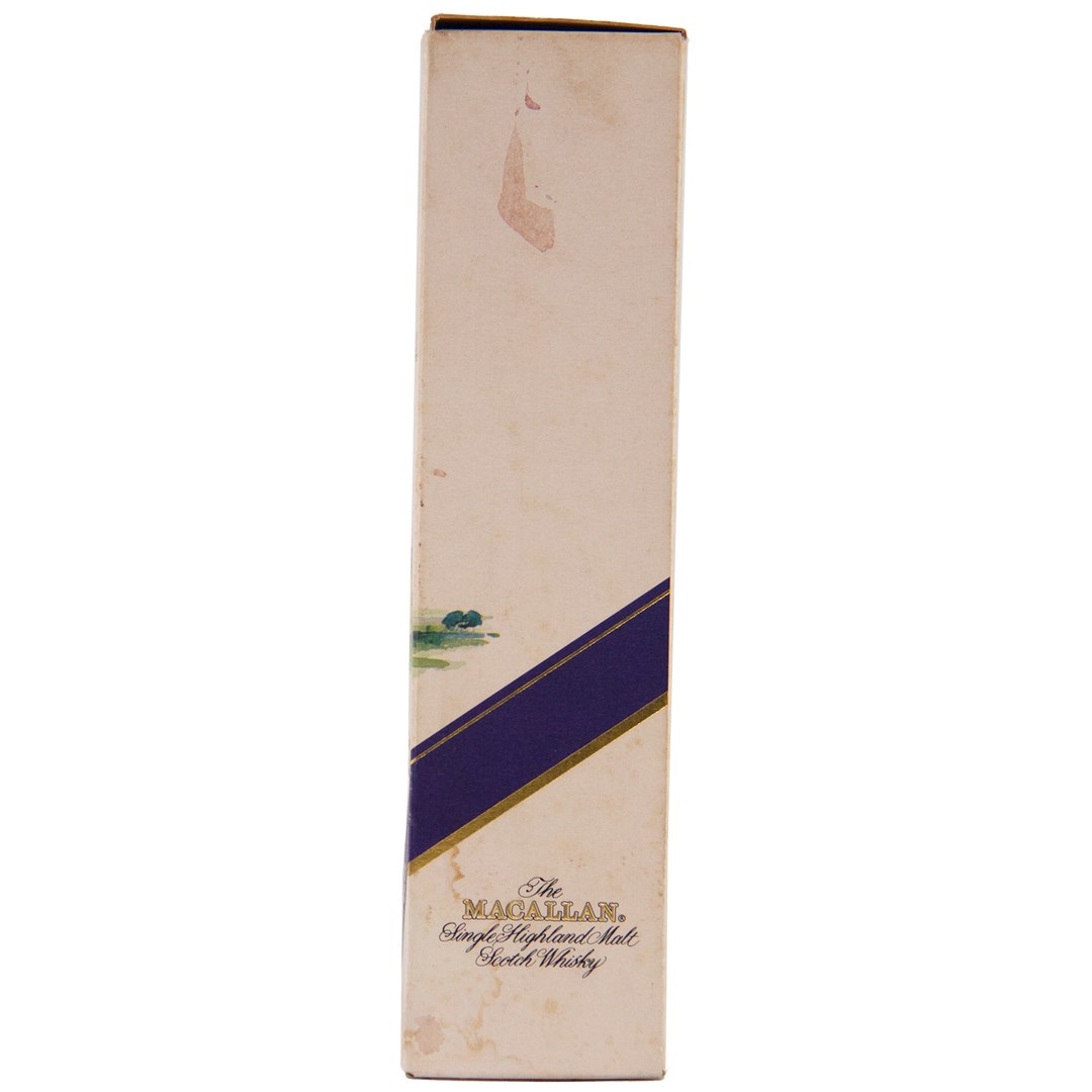 A tall, rectangular box with a cream background, purple diagonal stripe, and gold text reading The Macallan 1974 18 Year Old Sherry Single Malt Scotch Whisky. Shows slight discoloration and wear—a true collectible.