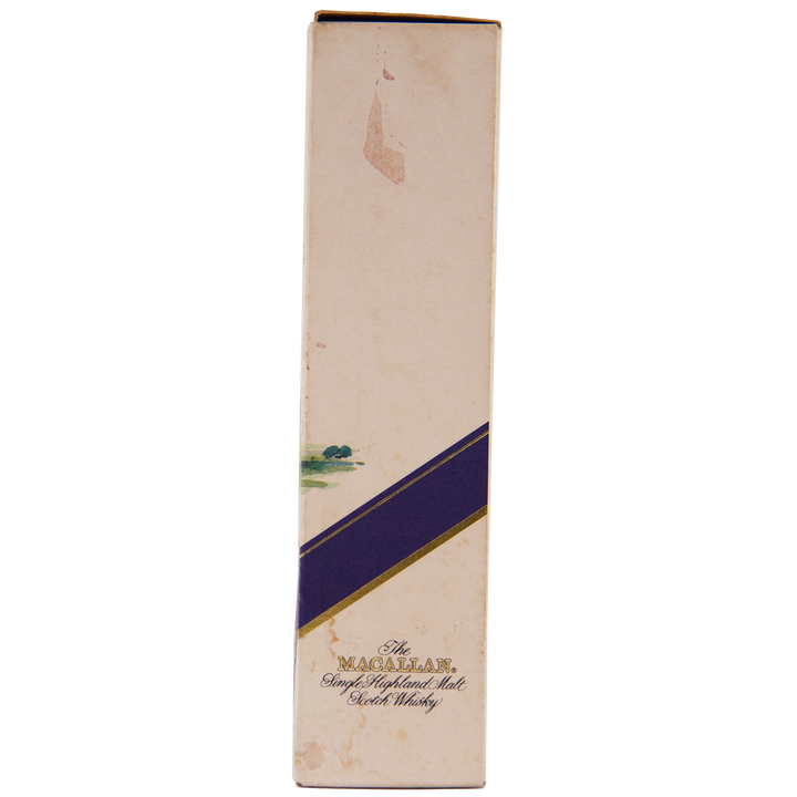 A tall, rectangular box with a cream background, purple diagonal stripe, and gold text reading The Macallan 1974 18 Year Old Sherry Single Malt Scotch Whisky. Shows slight discoloration and wear—a true collectible.