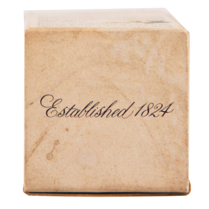 A close-up of a brown box for The Macallan 1974 18 Year Old Sherry Single Malt Scotch Whisky features elegant, cursive black text reading "Established 1824," highlighting its rich legacy and signature sherry oak maturation.
