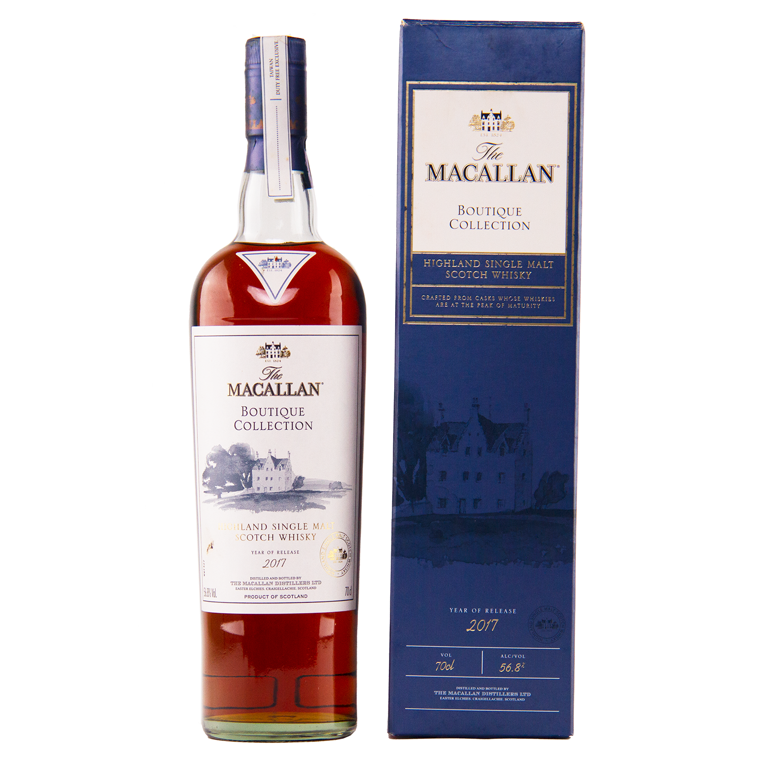 A bottle of The Macallan Boutique Collection 2017 Single Malt Whisky, a travel retail exclusive, stands beside its blue box featuring gold and white text plus a building illustration—one of the limited Macallan releases.