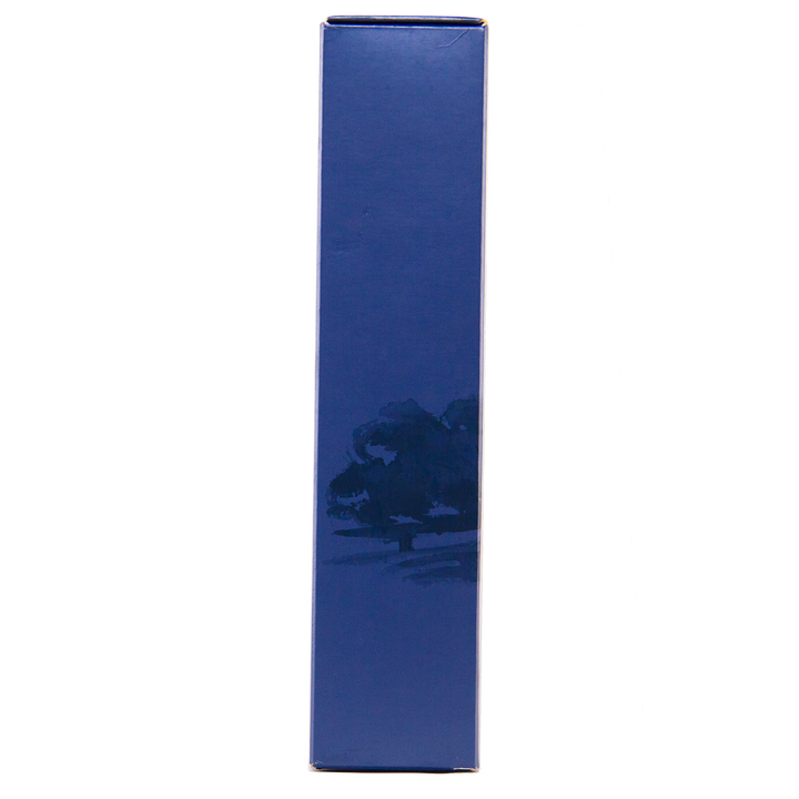 A tall, blue rectangular box stands upright against a white background with subtle trees at the base—a travel retail exclusive: The Macallan Boutique Collection 2017 Single Malt Whisky.