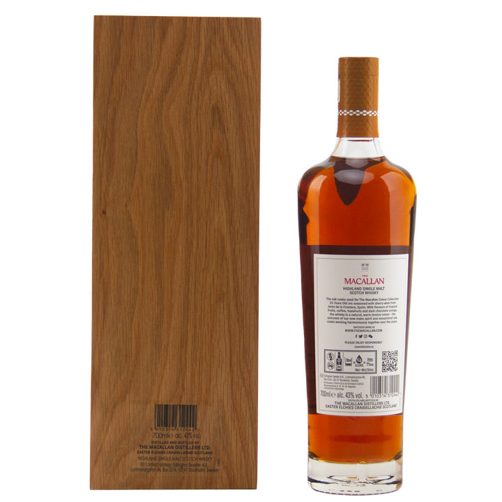 A bottle from The Macallan Colour Collection Set with a white label stands beside its tall, rectangular wooden box, both backs visible and showcasing sherry-seasoned oak maturation, set against a plain white background.
