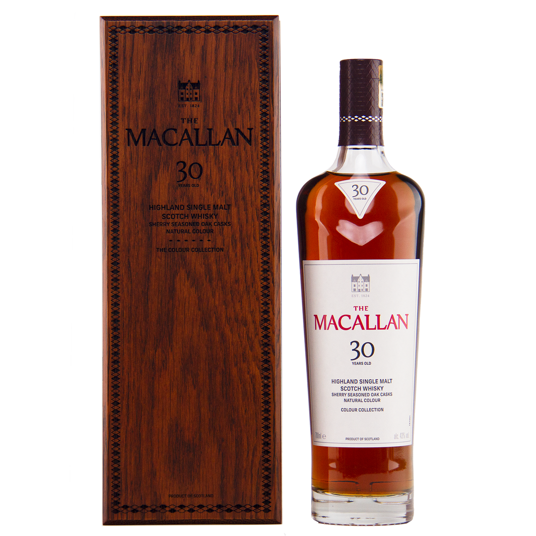 A bottle from The Macallan Colour Collection Set stands beside its elegant box, highlighting the artistry and craftsmanship that define this exceptional release.