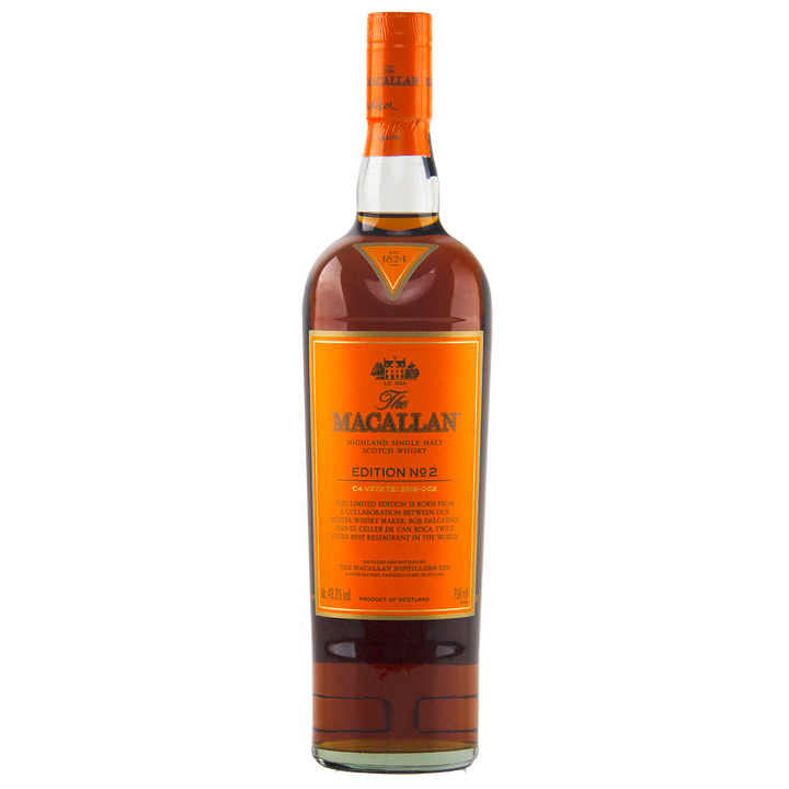 A bottle of The Macallan Edition 2 Single Malt Whisky, from the celebrated Edition Series, displays an orange label with gold and black text plus an orange-blue foil seal on the cap, all set against a white background.