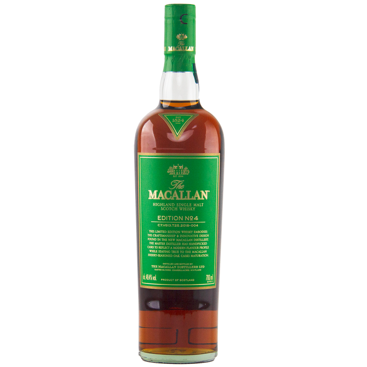 A bottle of The Macallan Edition 4 Single Malt Whisky with a green label and cap, featuring gold and white text, stands upright on a white background. It's part of the collectible Macallan Edition Series.