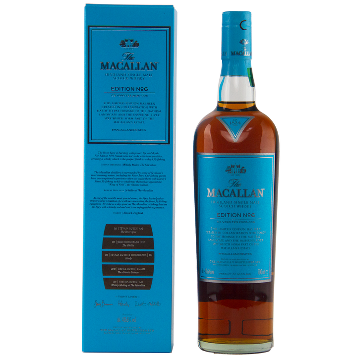 A bottle of The Macallan Edition 6 Single Malt Scotch Whisky stands next to its blue box, both featuring gold and white text highlighting this special release from The Macallan Edition Series.