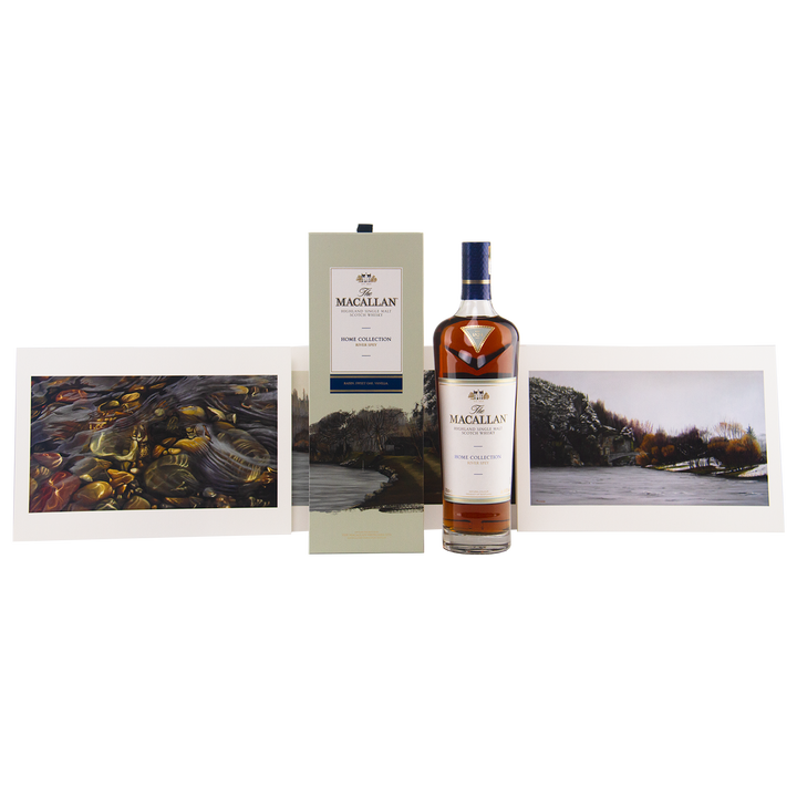 A bottle of The Macallan Home Collection 1 & 2 Single Malt Scotch Whisky stands between its box and two Giclée art prints from Home Collection 2, all set against a white background.