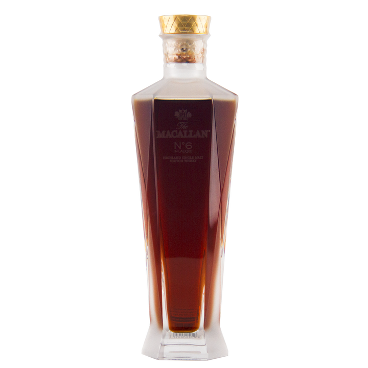 The Macallan No 6 Single Malt Scotch Whisky comes in a clear, faceted decanter-style bottle with a gold cap; its dark amber liquid is matured in sherry casks for exceptional richness.
