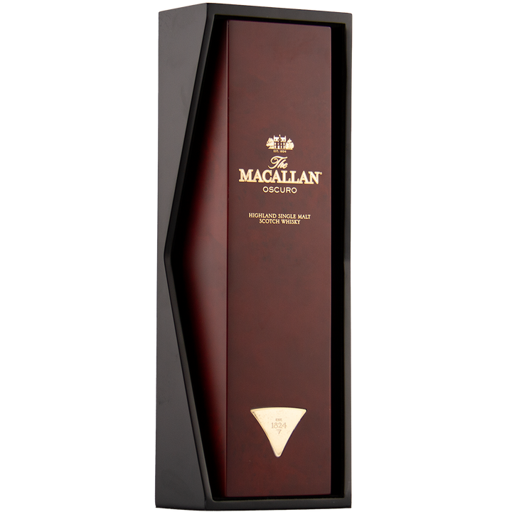 A rectangular box of The Macallan Oscuro Single Malt Scotch Whisky showcases a dark angular frame and gold lettering on a rich red-brown background, reflecting its maturation in sherry-seasoned oak casks.
