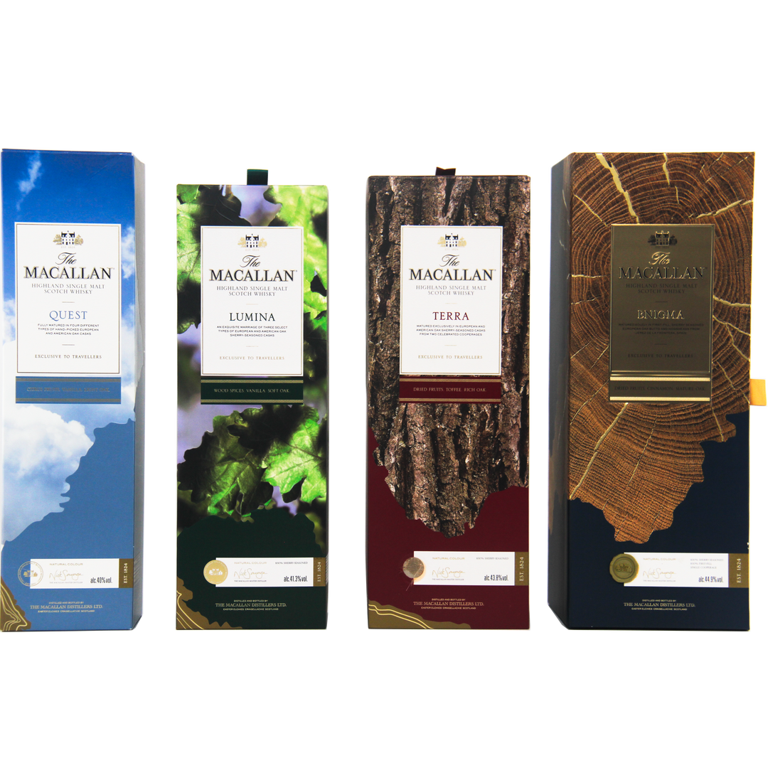 Four boxes of The Macallan Quest Complete Series are displayed side by side, each with unique designs—blue sky, green leaves, tree bark, and tree rings—symbolizing whisky maturation and ideal for travel retail shelves.