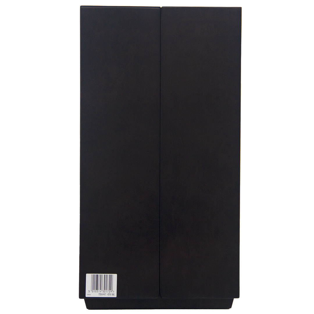 A sleek black rectangular box stands vertically with a barcode label at the bottom left corner on a plain white background, presenting The Macallan Reflexion Single Malt Scotch Whisky.