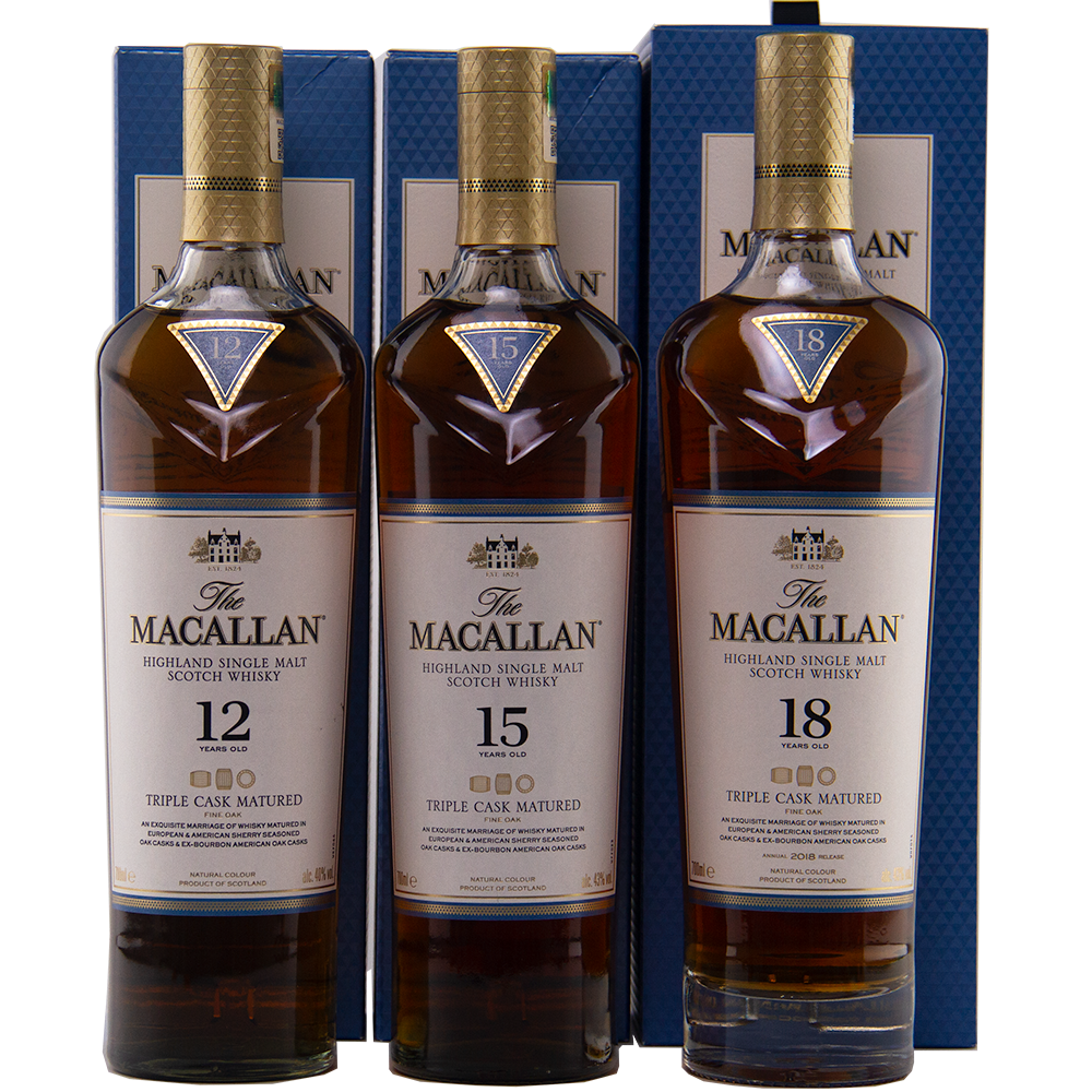 Three bottles of The Macallan Triple Cask 12, 15, and 18 stand with their boxes in a row, showcasing collectible whiskies from the renowned Macallan range.